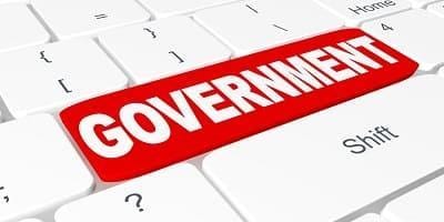 Prensa local 5 Tecla de teclado con la palabra 'GOVERNMENT' en rojo.