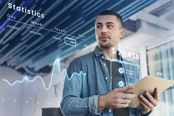 Mapas y datos 1 Hombre analizando datos financieros y gráficos en un entorno moderno.